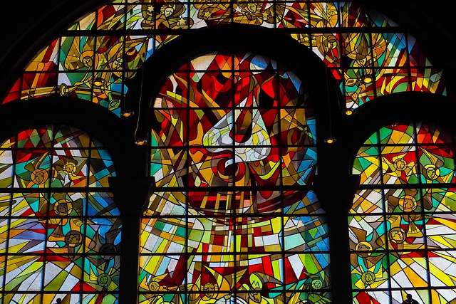 Holy Spirit in Red Stained Glass in a Church - Gold Nanoparticle Cancer Research page